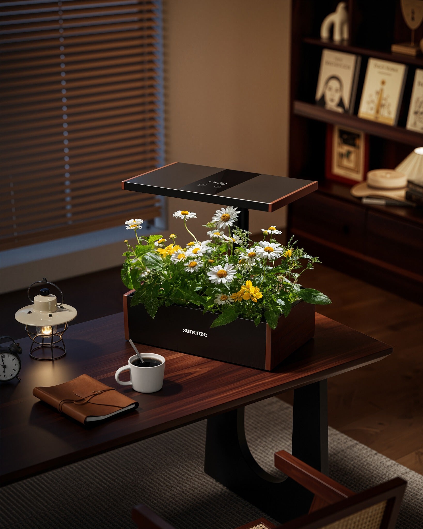 Modern indoor garden on a table with a cup and notebook in a cozy room.